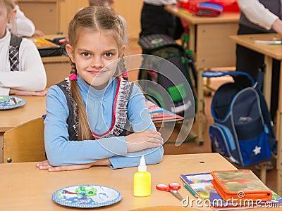 Happy first grader at lesson in school of technology, look in the frame Stock Photo