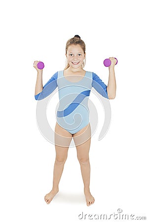 Happy fitness young girl lifting dumbbells smiling cheerful, fresh and energetic Stock Photo