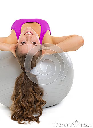 Happy fitness young woman doing abdominal crunch Stock Photo