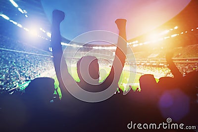 Happy football fans support their team Stock Photo
