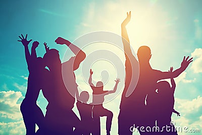 Happy friends, family jumping together having fun. Stock Photo