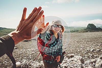 Happy Friends giving five hands traveling at mountains Stock Photo