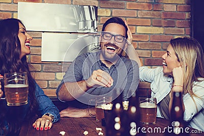 Happy friends group drinking beer at brewery bar restaurant Stock Photo