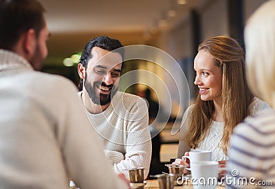 Happy friends meeting and drinking tea or coffee Stock Photo