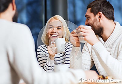 Happy friends meeting and drinking tea or coffee Stock Photo