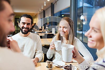 Happy friends meeting and drinking tea or coffee Stock Photo