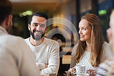 Happy friends meeting and drinking tea or coffee Stock Photo