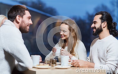 Happy friends meeting and drinking tea or coffee Stock Photo