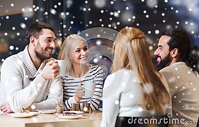 Happy friends meeting and drinking tea or coffee Stock Photo