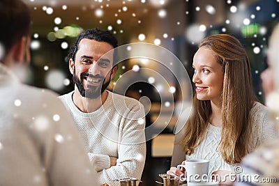 Happy friends meeting and drinking tea or coffee Stock Photo