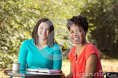 Friends reading, praying and learning together. Stock Photo