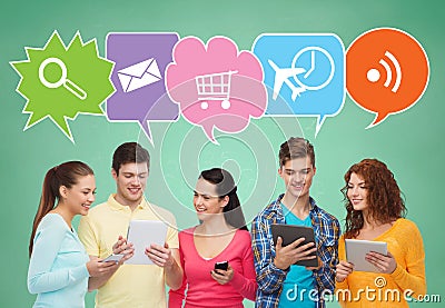 Happy friends with smartphones and tablet pc Stock Photo