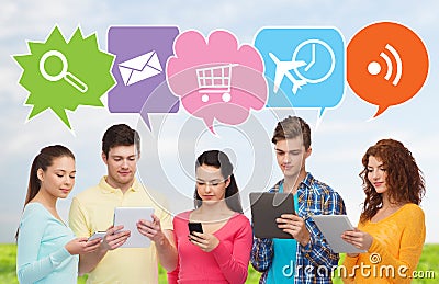 Happy friends with smartphones and tablet pc Stock Photo