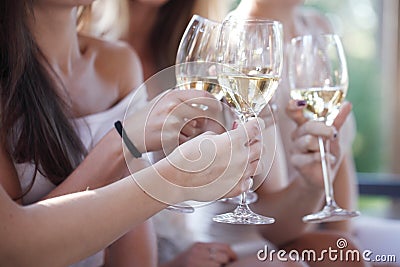 Happy friends toasting wine Stock Photo