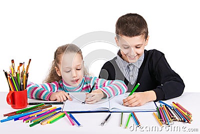 Happy funny kids draw. The boy and the girl draws pencils. Creativity concept. Stock Photo