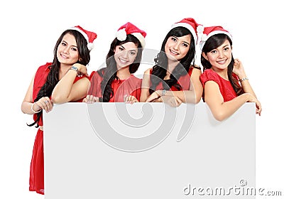 Happy funny people with christmas santa hat holding blank banner Stock Photo