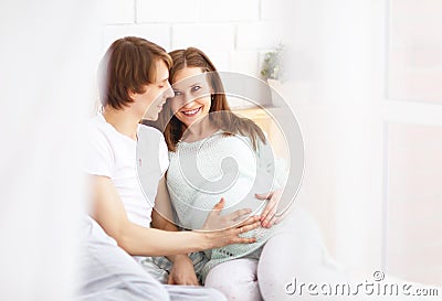 Happy future parents, dad and a pregnant mother in anticipation Stock Photo