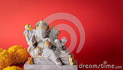 Happy Ganesh Chaturthi festival, Lord Ganesha statue with beautiful texture on red background, Ganesh is hindu god of Success Stock Photo