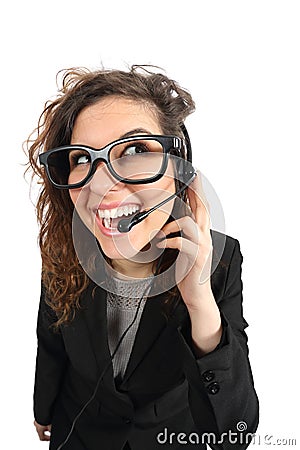 Happy geek telephone operator woman attending a call Stock Photo