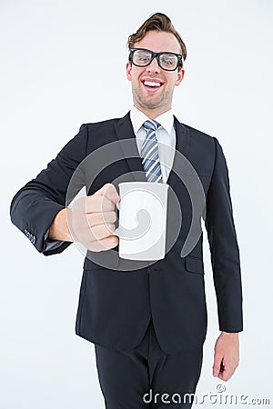 Happy geeky businessman holding coffee mug Stock Photo