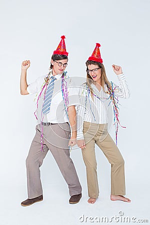 Happy geeky couple dancing Stock Photo