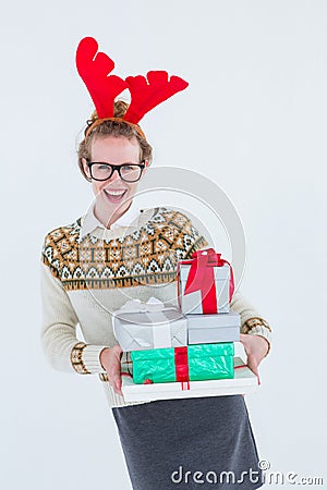 Happy geeky hipster holding presents Stock Photo