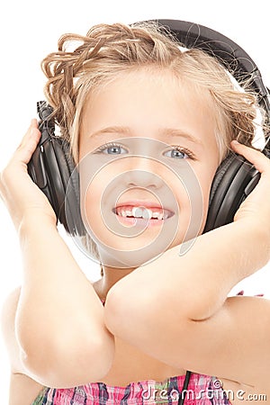 Happy girl in big headphones Stock Photo