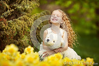 Happy girl in the blooming garden Stock Photo