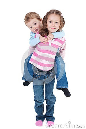 Happy girl carrying boy on back Stock Photo