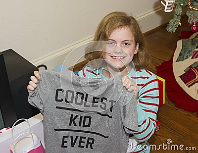 Happy girl with Christmas present Stock Photo