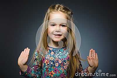 Happy girl. Closeup Portrait handsome child smiling isolated on grey Stock Photo