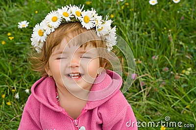 Happy girl with daisy wreath Stock Photo