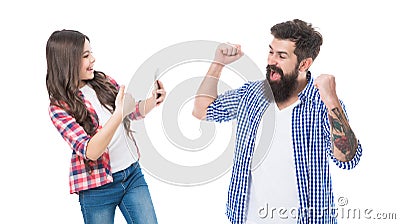 Happy girl daughter show thumbs up and take photo of euphoric man father making winning gesture isolated on white Stock Photo