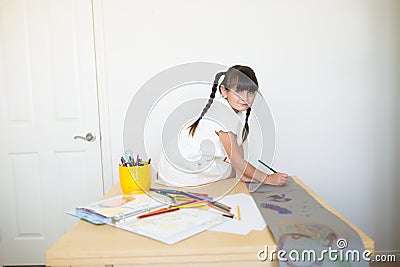 Happy girl doing art work Stock Photo