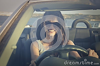 Happy girl driving a car Stock Photo