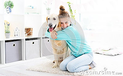 Happy girl embracing lovely dog Stock Photo