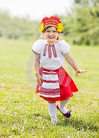 Happy girl in folk clothes Stock Photo