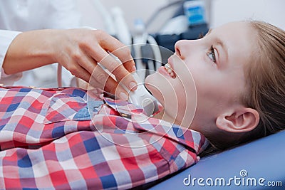 Happy girl getting ultrasonic neck scanning in the clinic Stock Photo