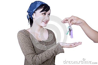 Happy girl given house key - isolated Stock Photo