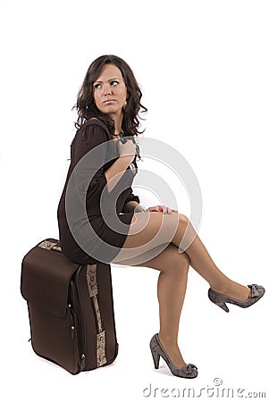 Happy girl going on vacation with her suitcase Stock Photo