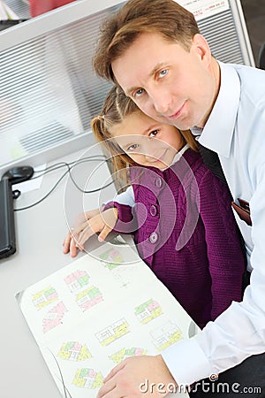 Happy girl and her father with apartment plan booklet Stock Photo