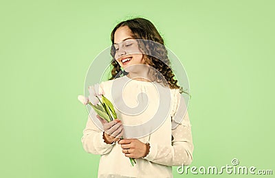 happy girl hold tulip flowers. spring bouquet. happy womens day. international childrens day. mothers day concept Stock Photo