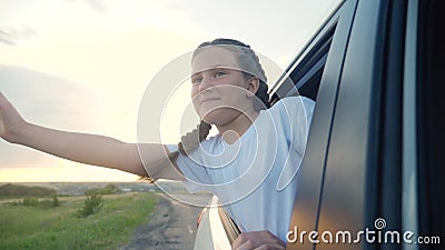 Happy Girl Kid Child Leaned Out of a Car Window Waving Hand. Happy ...