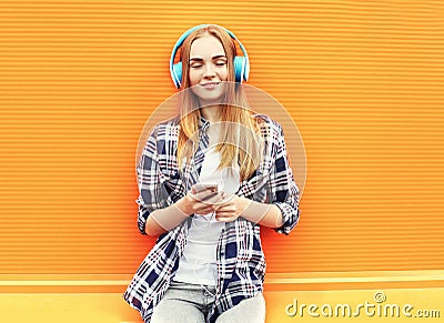 Happy girl listens and enjoys good music in headphones Stock Photo