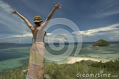 Happy girl on lonely island Stock Photo
