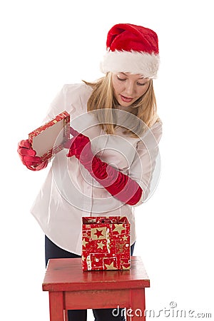 Happy girl opens a box with a gift Stock Photo