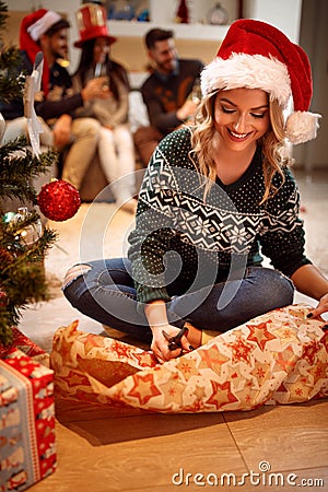 Girl packing gift for Christmas Stock Photo