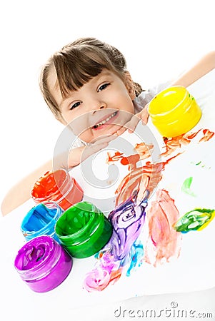 Happy girl painting with finger paints Stock Photo