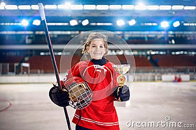 Happy girl player ice hockey winner trophy Stock Photo
