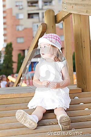 Happy girl in playground Stock Photo